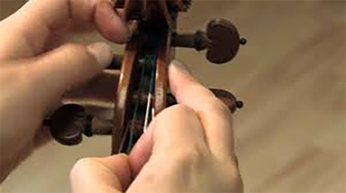 Changing violin strings clearance